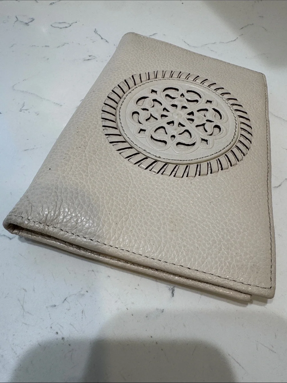 Brighton Cream Pebbled Leather Ferrara Fold Wallet with Embossed Medallion